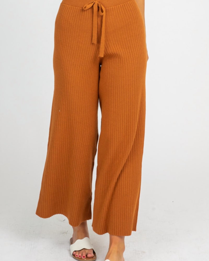 Front of a model wearing a size L Rib Knit Flare Pants In Caramel in Caramel by Avvio LA. | dia_product_style_image_id:347739